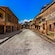 An empty street lined with ancient stone building in the Roman town of Herculaneum